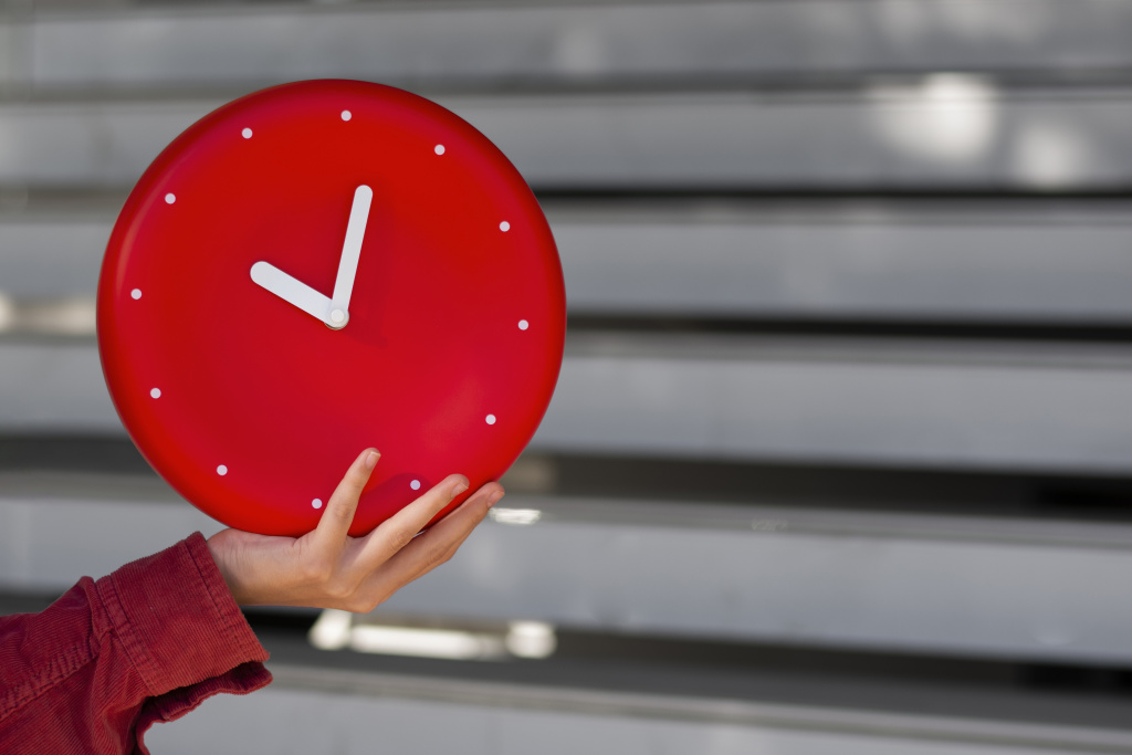 hand-holding-wall-clock-still-life.jpg
